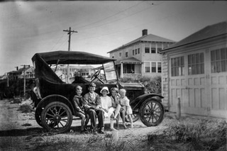 1928_Rockwells_(Bil_Forbes_Mary_Caroline_Tom)in_Nantucket_running_board.jpeg